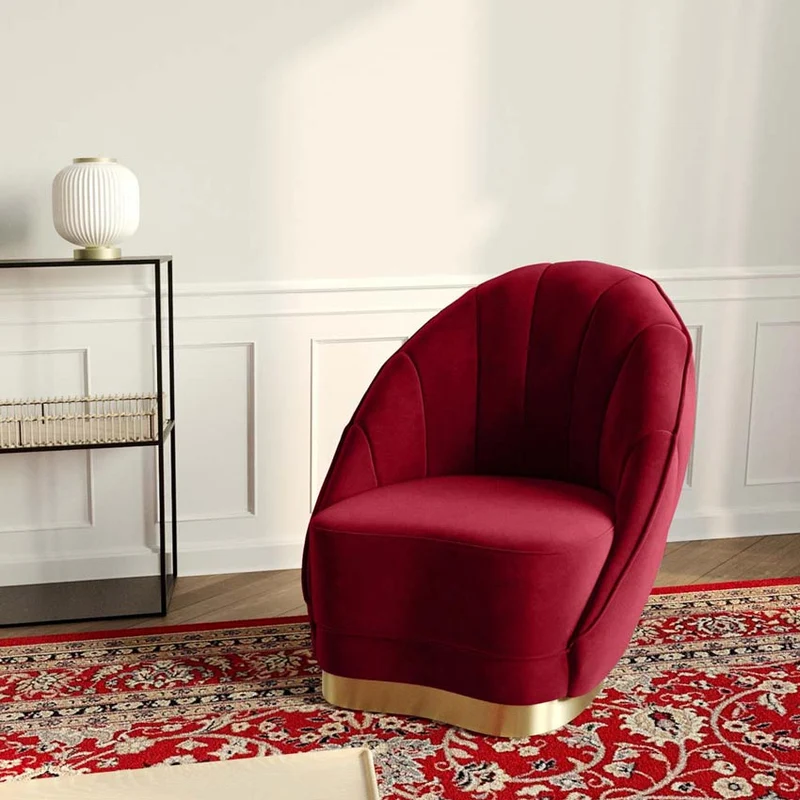 Fauteuil en velours bordeaux, base cerclage dor effet laiton