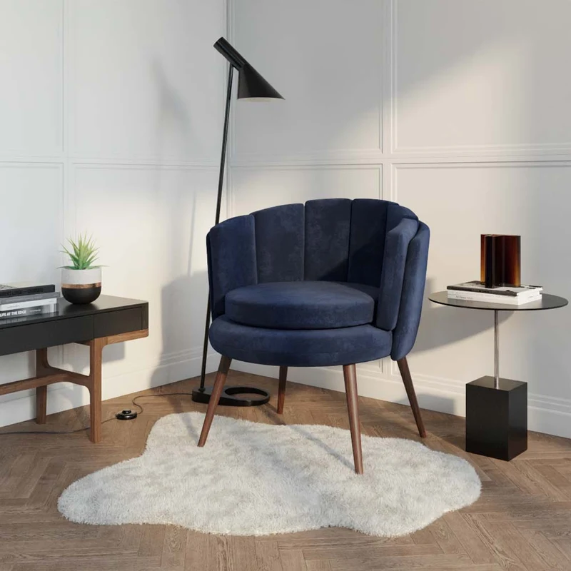 Fauteuil en velours bleu nuit