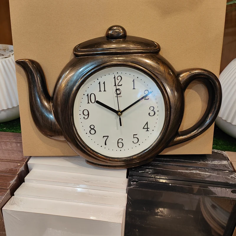 ساعة حائط على شكل إبريق شاي 42×30 سم